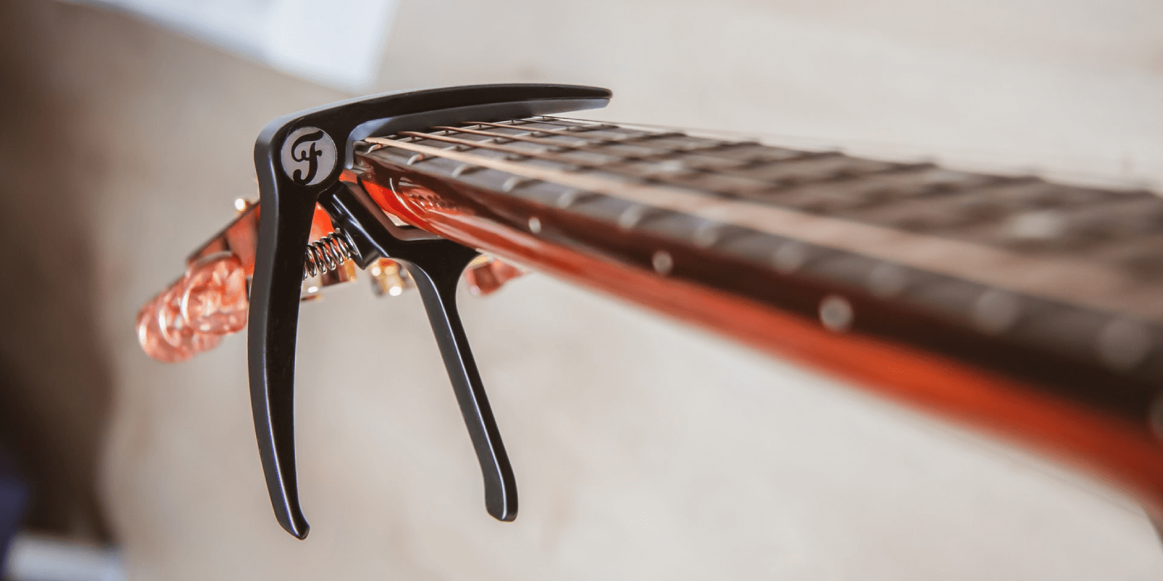 various types of capo for a guitar